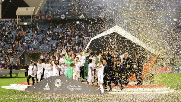 Real Madrid players celebrate with the trophy after winning the Spanish Super Cup  - Sputnik International