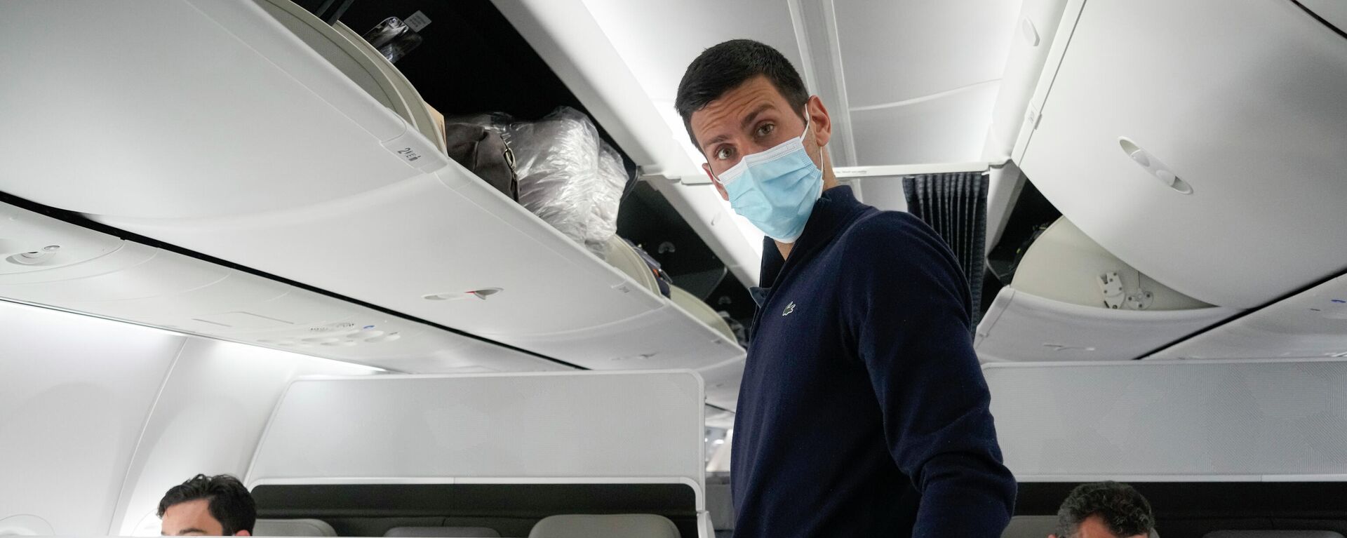 Novak Djokovic prepares to take his seat on a plane to Belgrade, in Dubai, United Arab Emirates, Monday, Jan. 17, 2022 - Sputnik International, 1920, 17.01.2022