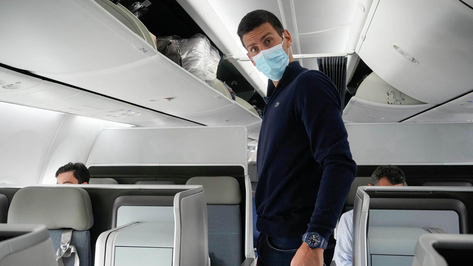 Novak Djokovic prepares to take his seat on a plane to Belgrade, in Dubai, United Arab Emirates, Monday, Jan. 17, 2022 - Sputnik International, 1920, 17.01.2022