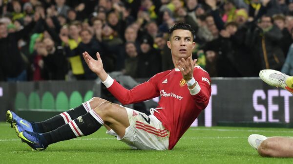 Manchester United's Cristiano Ronaldo reacts during the English Premier League soccer match between Norwich City and Manchester United at Carrow road in Norwich, England, Saturday, Dec.11, 2021 - Sputnik International