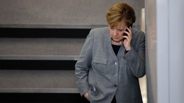 FILE - In this Oct. 24, 2017 file photo German Chancellor Angela Merkel phones during a break of the first meeting of the German parliament after the election in Berlin, Germany - Sputnik International