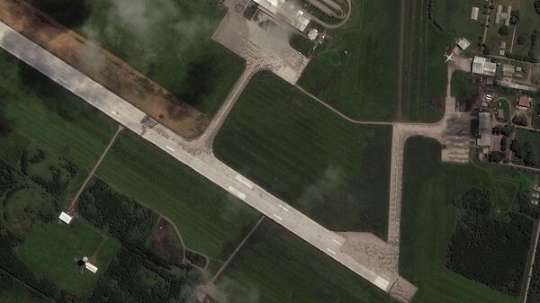 A satellite image shows the main runway of the Fua'amotu International Airport partially blocked due to volcanic ash from the eruption of the Hunga Tonga-Hunga Ha'apai volcano, in Nuku'alofa, Tonga, January 18, 2022. - Sputnik International