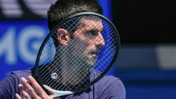 FILE - Defending champion Serbia's Novak Djokovic practices ahead of the Australian Open tennis championship in Melbourne, Australia, Jan. 12, 2022 - Sputnik International