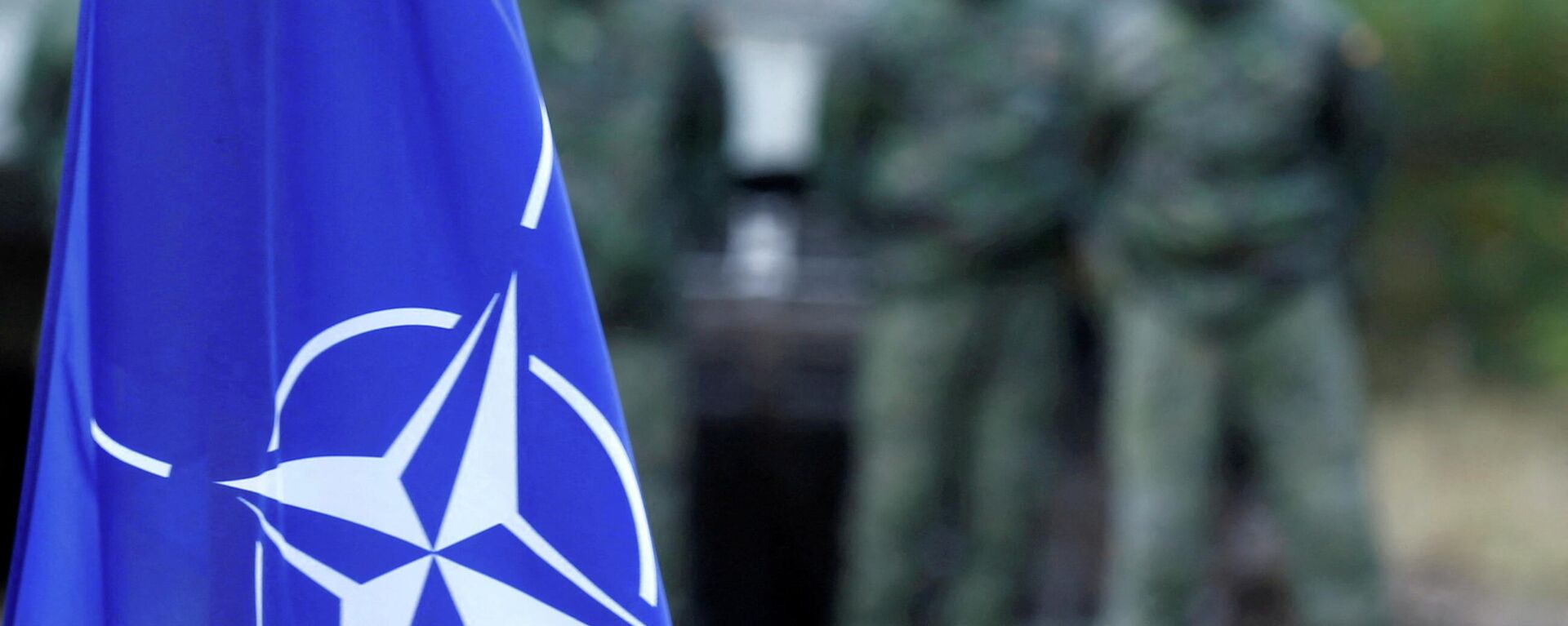 NATO flag is seen during NATO enhanced Forward Presence battle group military exercise Silver Arrow in Adazi, Latvia October 5, 2019. REUTERS/Ints Kalnins/File Photo - Sputnik International, 1920, 19.02.2022