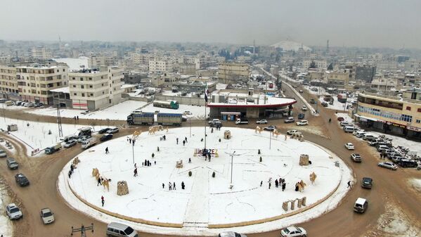 A picture taken by a drone shows an aerial view of snow-covered Azaz, Syria. 23 January 2022. - Sputnik International