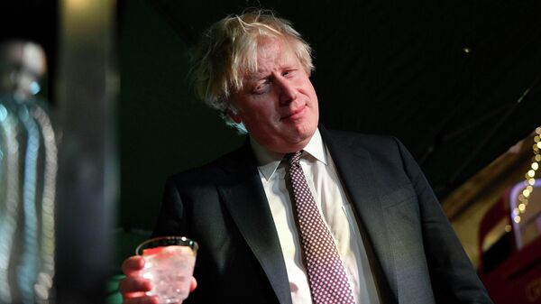Britain's Prime Minister Boris Johnson samples an Isle of Harris gin as he visits a UK Food and Drinks market, set up in Downing Street, London, Tuesday Nov. 30, 2021 - Sputnik International