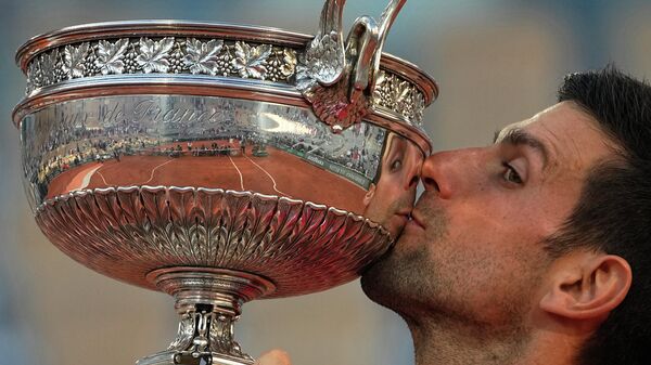 FILE - Serbia's Novak Djokovic kisses the cup after defeating Stefanos Tsitsipas of Greece during their final match of the French Open tennis tournament at the Roland Garros stadium Sunday, June 13, 2021 in Paris - Sputnik International