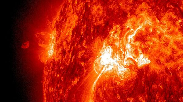 The Sun popped off an M-Class (moderate level) flare on Sept. 25, 2011 that sent a plume of plasma out above the Sun, but a good portion of it appeared to fall back towards the active region from where it launched. - Sputnik International
