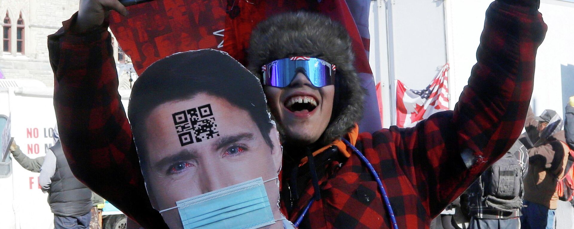 A protestor wears a cutout image of Canada's Prime Minister Justin Trudeau as truckers take part in a convoy to protest coronavirus disease (COVID-19) vaccine mandates for cross-border truck drivers in Ottawa, Ontario, Canada, January 29, 2022. - Sputnik International, 1920, 30.01.2022
