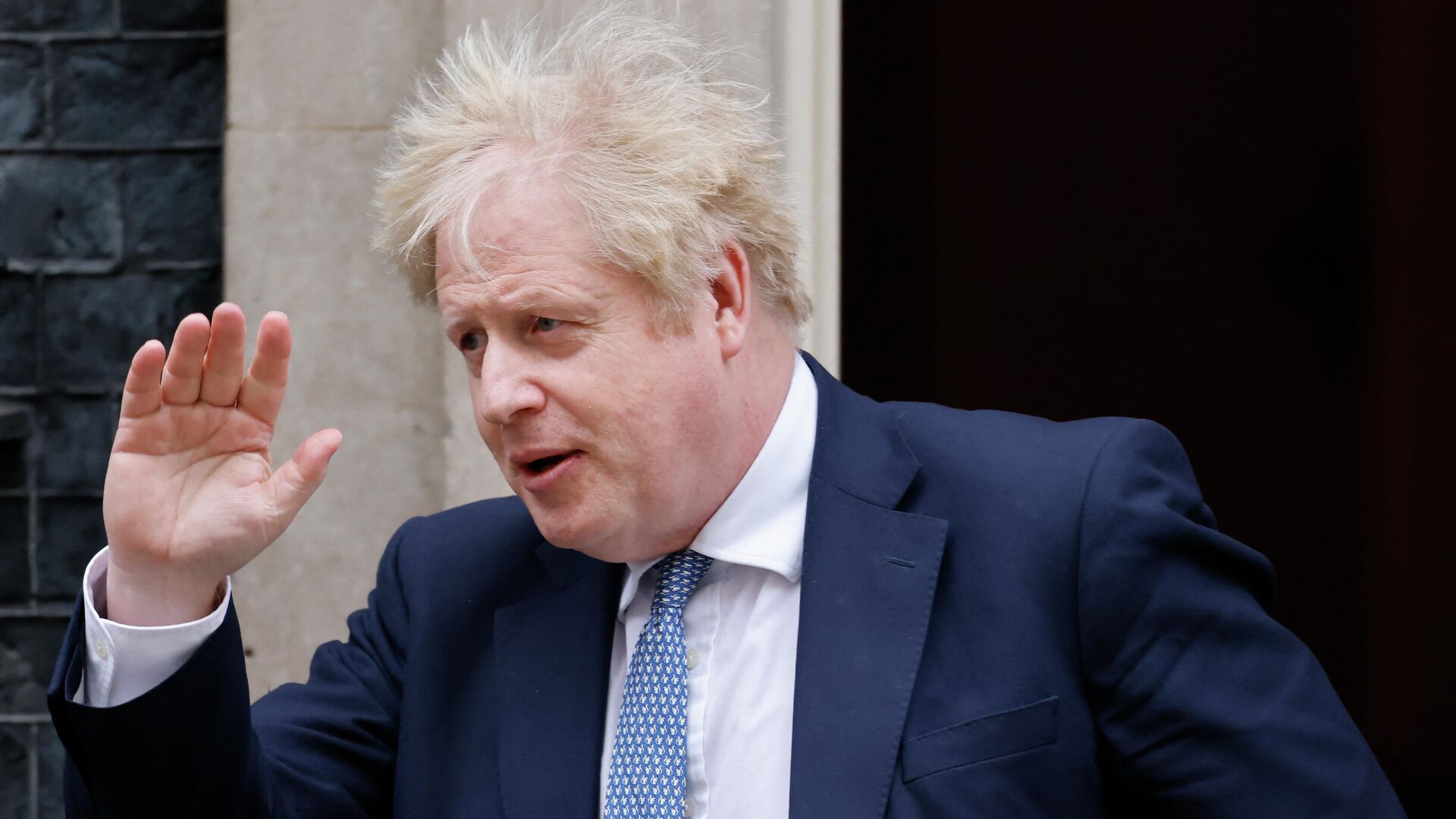 Britain's Prime Minister Boris Johnson waves as he leaves from 10 Downing Street in central London on February 2, 2022 to take part in the weekly session of Prime Minister's Questions (PMQs) at the House of Commons. - Sputnik International, 1920, 02.02.2022