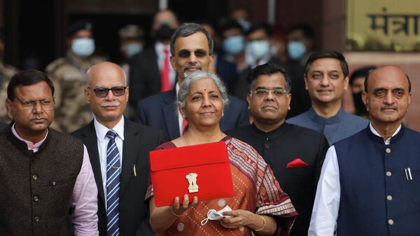 India's Finance Minister Nirmala Sitharaman holds up a folder with the Government of India’s logo as she leaves her office to present the federal budget in the parliament in New Delhi, India, February 1, 2022.  - Sputnik International