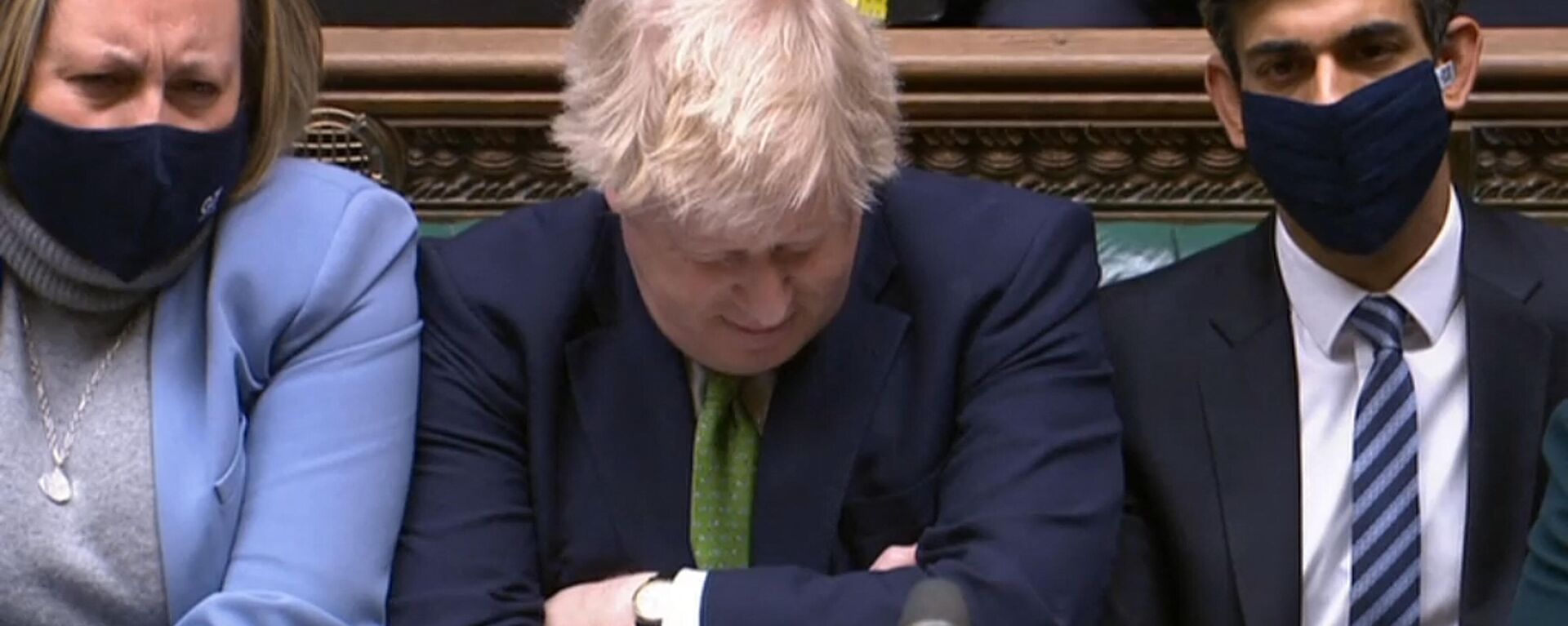 A video grab from footage broadcast by the UK Parliament's Parliamentary Recording Unit (PRU) shows British Prime Minister Boris Johnson reacting as Britain's main opposition Labour Party leader Keir Starmer (unseen) speaks during Prime Minister's Questions (PMQs), in the House of Commons in London on January 19, 2022 - Sputnik International, 1920, 03.02.2022