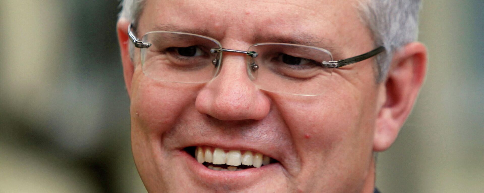 Australia's Immigration Minister Scott Morrison smiles during an interview with Reuters in Phnom Penh September 26, 2014. Cambodia has agreed to resettle potentially hundreds of refugees intercepted while trying to reach Australia in exchange for an extra A$40 million ($35 million) in aid, Australia's immigration minister said on Friday.  - Sputnik International, 1920, 04.02.2022