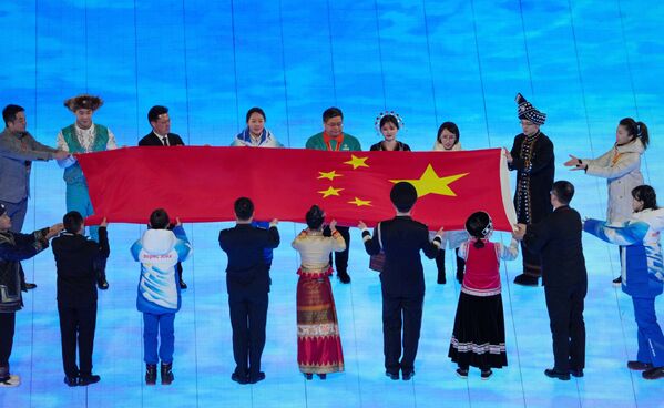 China&#x27;s national flag being brought into the stadium during the opening ceremony of the 2022 Winter Olympics in Beijing. - Sputnik International
