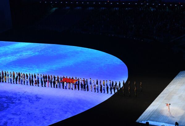 2022 Beijing Olympics - Opening Ceremony at the National Stadium, Beijing, China on 4 February 2022. The Chinese national flag is carried during the opening ceremony. - Sputnik International