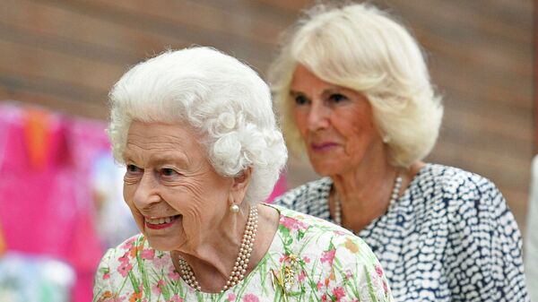 Britain's Queen Elizabeth II, foreground and Camilla, the Duchess of Cornwall attend an event in celebration of 'The Big Lunch 'initiative, during the G7 summit in Cornwall, England, Friday June 11, 2021 - Sputnik International