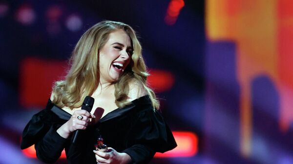 Adele receives the award for Album of the Year at the Brit Awards at the O2 Arena in London, Britain, February 8, 2022 - Sputnik International