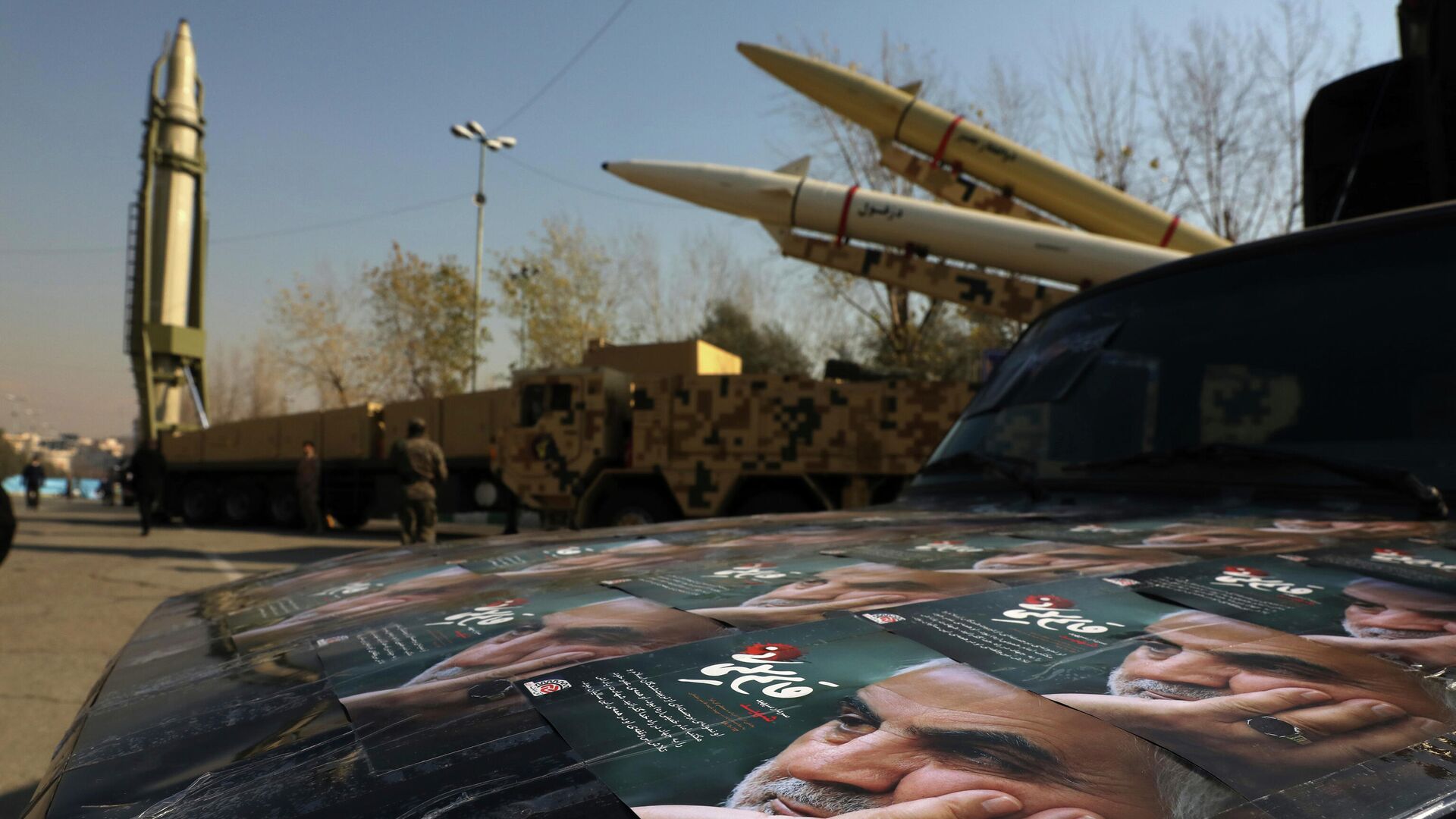 Posters of Iranian Gen. Qassem Soleimani, who was killed in Iraq in a U.S. drone attack in Jan. 3, 2020, are seen in front of Qiam, background left, Zolfaghar, top right, and Dezful missiles displayed in a missile capabilities exhibition by the paramilitary Revolutionary Guard a day prior to second anniversary of Iran's missile strike on U.S. bases in Iraq in retaliation for killing Gen. Soleimani, at Imam Khomeini grand mosque, in Tehran, Iran, Friday, Jan. 7, 2022. Iran put three ballistic missiles on display on Friday, as talks in Vienna aimed at reviving Tehran's nuclear deal with world powers flounder. (AP Photo/Vahid Salemi) - Sputnik International, 1920, 09.02.2022