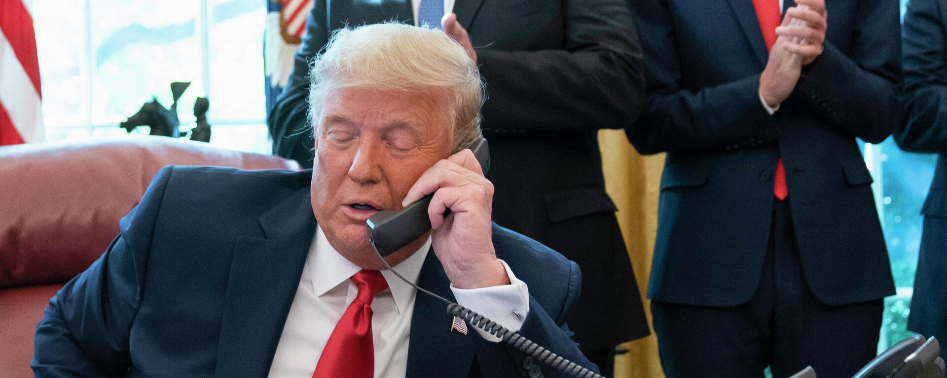  In this Oct. 23, 2020, photo, President Donald Trump talks on a phone during a call with the leaders of Sudan and Israel in the Oval Office of the White House, in Washington.  - Sputnik International, 1920, 23.02.2022