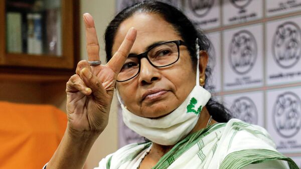 Chief Minister of West Bengal state and Trinamool Congress party leader Mamata Banerjee displays the victory symbol as she arrives to announce the names of the party's candidates for the upcoming legislative assembly elections in Kolkata, India, Friday, March 5, 2021. The eight phased legislative assembly elections in the state are scheduled to begin on March 27.  - Sputnik International