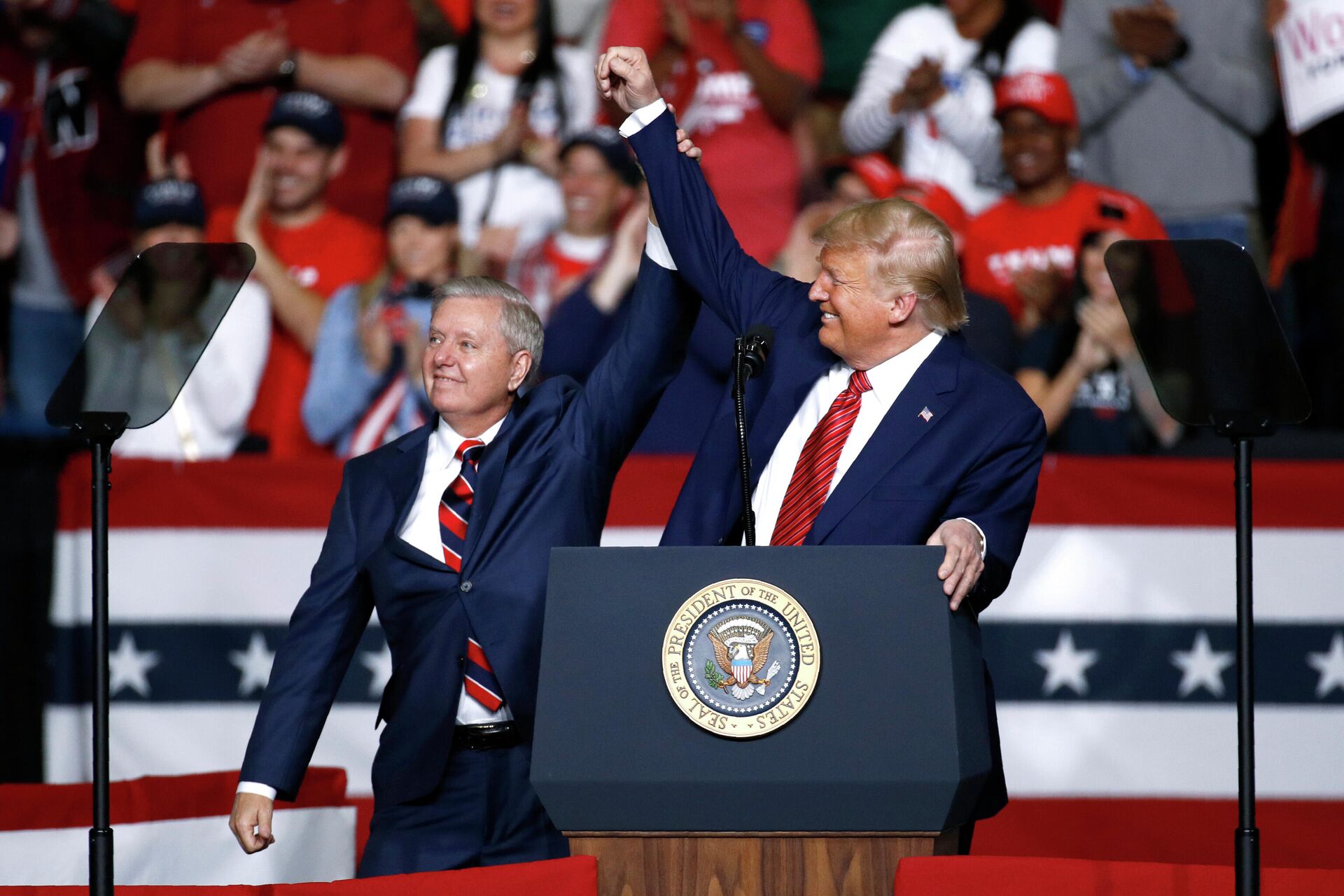 In this Feb. 28, 2020 file photo, Sen. Lindsey Graham, R-S.C., left, stands onstage with President Donald Trump during a campaign rally, in North Charleston, S.C. Jaime Harrison has raised more money than his Republican opponent, Sen. Lindsey Graham, two quarters in a row.  - Sputnik International, 1920, 14.02.2022
