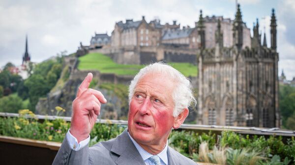 Britain's Prince Charles, Prince of Wales, known as the Duke of Rothesay when in Scotland, reacts during his visit to Johnnie Walker Princes Street in Edinburgh on October 1, 2021 - Sputnik International