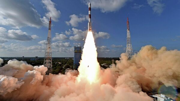 This handout photo provided by the Indian Space Research Organization shows PSLV-C48 lifting off at the Satish Dhawan Space Center in Sriharikota, India, Wednesday, Dec. 11, 2019.
India’s Polar Satellite Launch Vehicle successfully launched RISAT-2BR1 along with nine commercial satellites, according to a press release. RISAT-2BR1 is a radar imaging earth observation satellite weighing about 628 kg, it said - Sputnik International