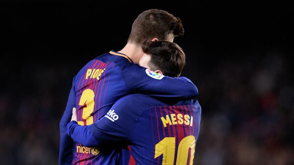 Barcelona's Argentinian forward Lionel Messi celebrates with Barcelona's Spanish defender Gerard Pique after scoring a third goal during the Spanish league football match between FC Barcelona and Club Deportivo Leganes SAD at the Camp Nou stadium in Barcelona on April 7, 2018.  - Sputnik International