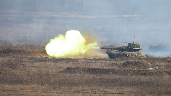 A tank of the Ukrainian armed forces fires during tactical military exercises at a training ground in the Rivne region, Ukraine February 16, 2022 - Sputnik International