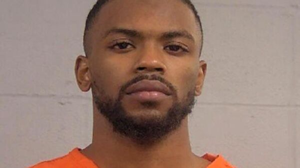 This photo provided by Louisville Metro Department of Corrections shows Quintez Brown.  A candidate for Louisville's metro council, Brown stands charged with attempted murder, accused of opening fire on a mayoral candidate whose shirt was grazed by a bullet in his campaign headquarters, police said Tuesday, Feb. 15, 2022. - Sputnik International
