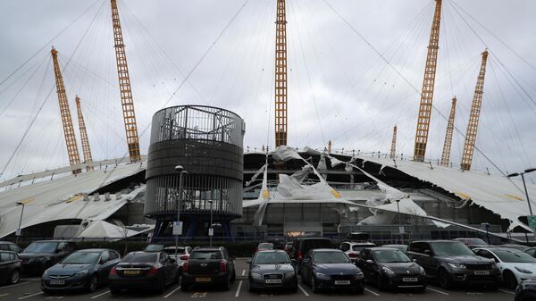 The white-domed roof of the O2 arena is seen damaged by the wind, as a red weather warning was issued due to Storm Eunice, in London, Britain, February 18, 2022 - Sputnik International