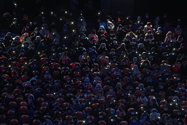 Spectators at the National Stadium in Beijing prior to the beginning of the closing ceremony of the 2022 Winter Olympics. - Sputnik International