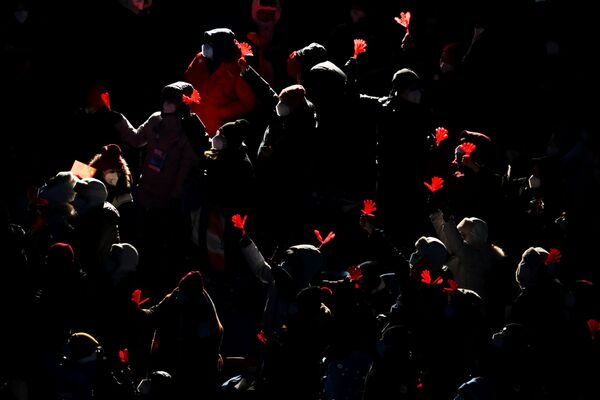 Spectators at the National Stadium in Beijing prior to the beginning of the closing ceremony of the 2022 Winter Olympics. - Sputnik International