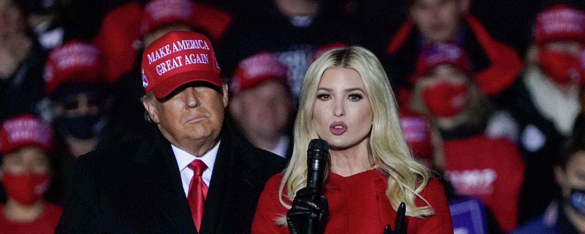 In this Nov. 2, 2020 file photo, Ivanka Trump speaks at a campaign event while her father, President Donald Trump, watches in Kenosha, Wis. New York's attorney general has sent a subpoena to the Trump Organization for records related to consulting fees paid to Ivanka Trump as part of a broad civil investigation into the president's business dealings, a law enforcement official said Thursday, Nov. 19, 2020 - Sputnik International, 1920, 16.11.2022