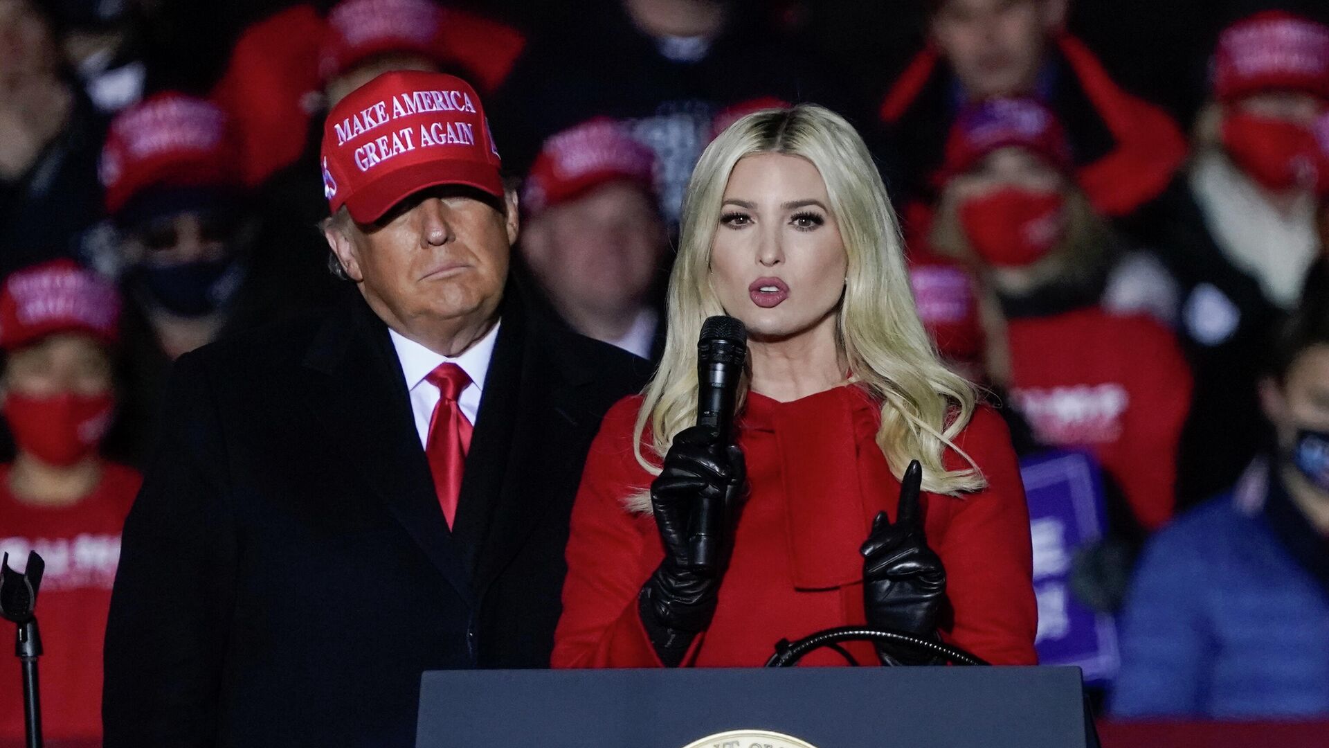 In this Nov. 2, 2020 file photo, Ivanka Trump speaks at a campaign event while her father, President Donald Trump, watches in Kenosha, Wis. New York's attorney general has sent a subpoena to the Trump Organization for records related to consulting fees paid to Ivanka Trump as part of a broad civil investigation into the president's business dealings, a law enforcement official said Thursday, Nov. 19, 2020 - Sputnik International, 1920, 10.06.2022