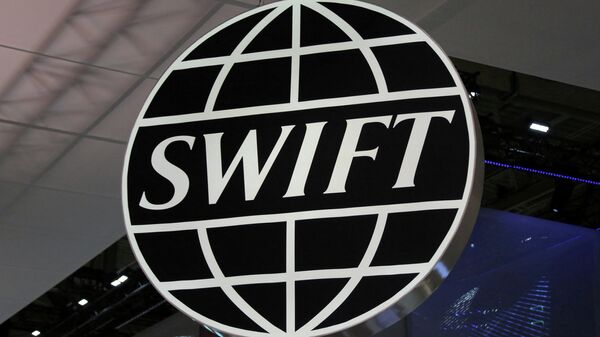 The logo of global secure financial messaging services cooperative SWIFT is seen at the SIBOS banking and financial conference in Toronto, Ontario, Canada October 19, 2017 - Sputnik International