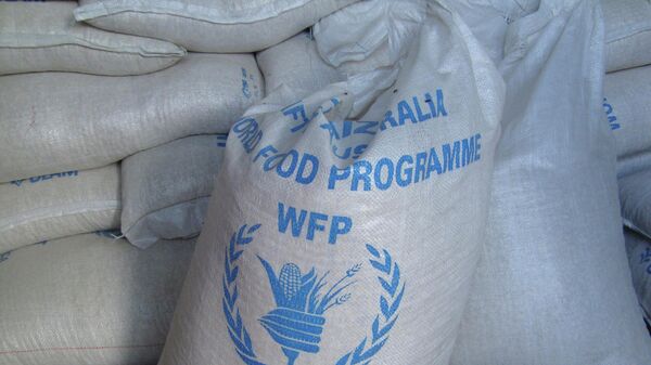 In this photo of Monday, Aug. 8, 2011 sacks of World Food Program, WFP, food is seen on a truck before being dropped off for storage in warehouses in the former Somali water agency that runs the biggest sell off of food aid in Mogadishu. - Sputnik International