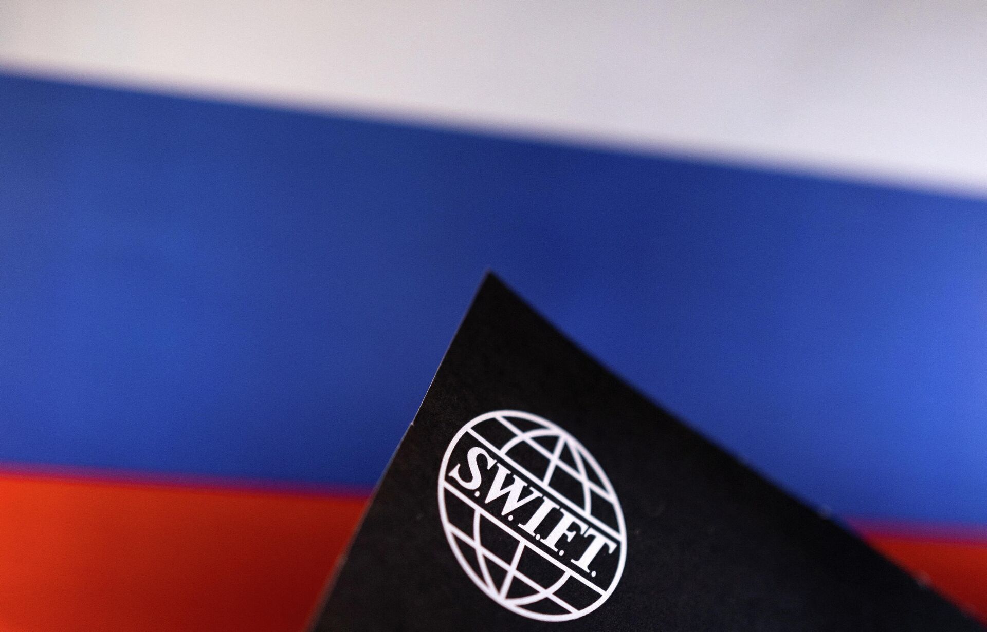 Swift logo is placed on a Russian flag are seen in this illustration taken, Bosnia and Herzegovina, February 25, 2022.  - Sputnik International, 1920, 27.02.2022