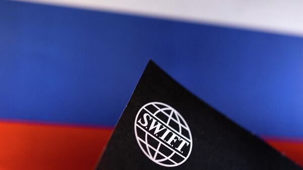 Swift logo is placed on a Russian flag are seen in this illustration taken, Bosnia and Herzegovina, February 25, 2022.  - Sputnik International