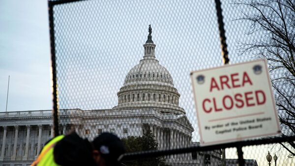 The U.S. Capitol, seen behind newly installed security fencing ahead of the upcoming State of the Union with U.S. President Joe Biden, in Washington, U.S., February 27, 2022. - Sputnik International