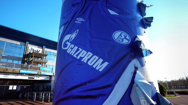 A tattered advertising for a Schalke shirt with the main sponsor Gazprom logo is seen outside the Schalke Arena in Gelsenkirchen, Germany, Monday, Feb. 28, 2022 - Sputnik International