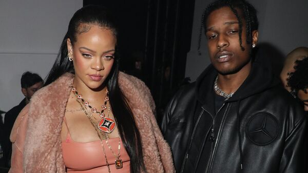 Rihanna, left, and ASAP Rocky arrive for the Off-White Ready To Wear Fall/Winter 2022-2023 fashion collection, unveiled during the Fashion Week in Paris, Monday, Feb. 28, 2022.  - Sputnik International