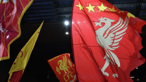 Liverpool supporters wave banners featuring the 'liver bird' of Liverpool FC's crest ahead of the UEFA Champions League 1st round Group B football match between Liverpool and AC Milan at Anfield in Liverpool, north west England on September 15, 2021 - Sputnik International