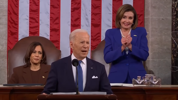 House Speaker Nancy Pelosi (D-CA) stops herself from clapping as US President Joe Biden speaks about toxic burn pits in Iraq and Afghanistan during his 2022 State of the Union Address on March 1, 2022. - Sputnik International