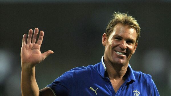 (FILES) In this file photograph taken on May 20, 2011, Australian bowling legend and Rajasthan Royals' captain Shane Warne waves to the crowd as he leaves the field after his last international match -  - Sputnik International