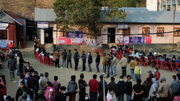 Voters wait outside a polling booth during the first phase of Manipur state elections in Imphal, India, Monday, Feb. 28, 2022 - Sputnik International