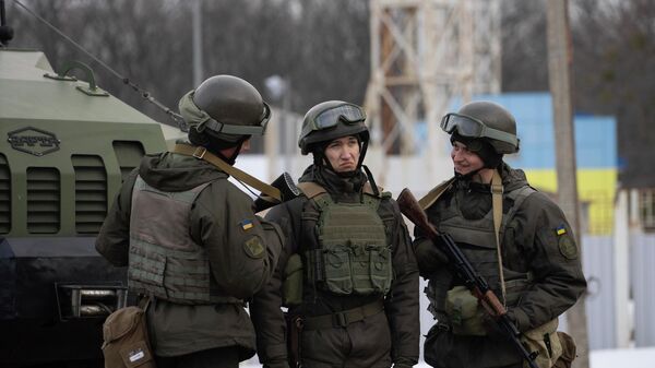 Ukrainian National guard soldiers talk to each other as they guard a mobile checkpoint together with the Ukrainian Security Service agents and police officers during a joint operation, in Kharkiv, Ukraine, Thursday, Feb. 17, 2022 - Sputnik International
