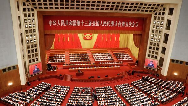 A general view of delegates attending the opening session of the National People's Congress (NPC) as Chinese Premier Li Keqiang speaks, at the Great Hall of the People in Beijing, China March 5, 2022. REUTERS/Carlos Garcia Rawlins - Sputnik International