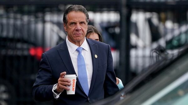 New York Gov. Andrew Cuomo prepares to board a helicopter after announcing his resignation, Aug. 10, 2021, in New York.  - Sputnik International