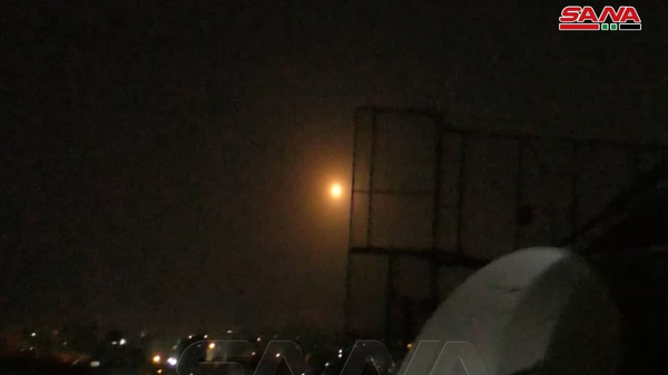 A photo of an alleged missile attack repelled by the Syrian air defense systems on March 7, 2022. - Sputnik International